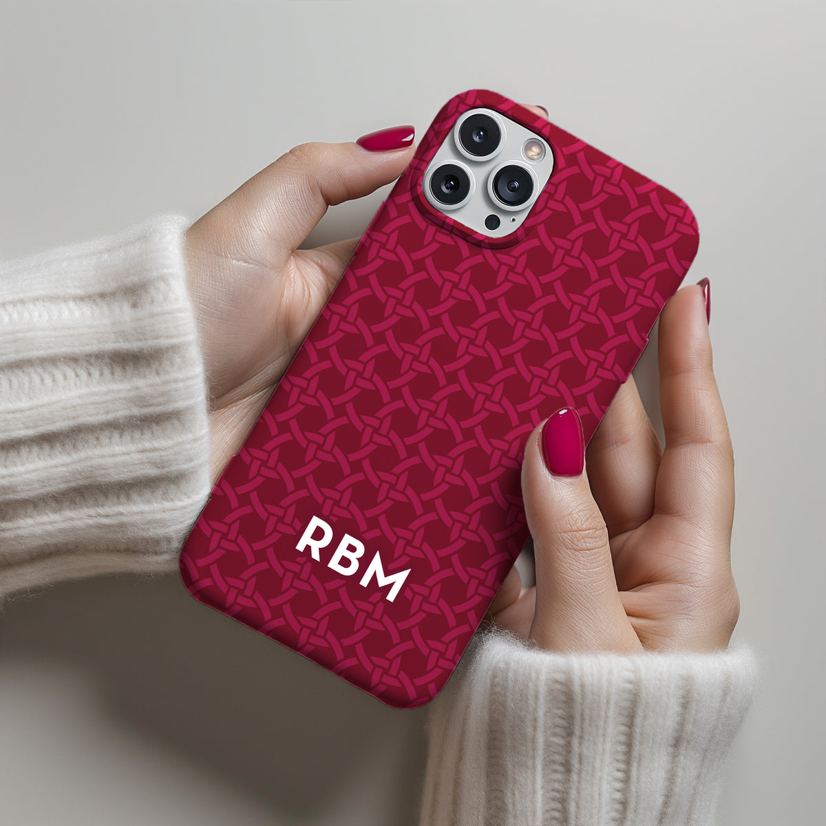 Elevate your phone with our interwoven circles phone case in rich Cardinal red.