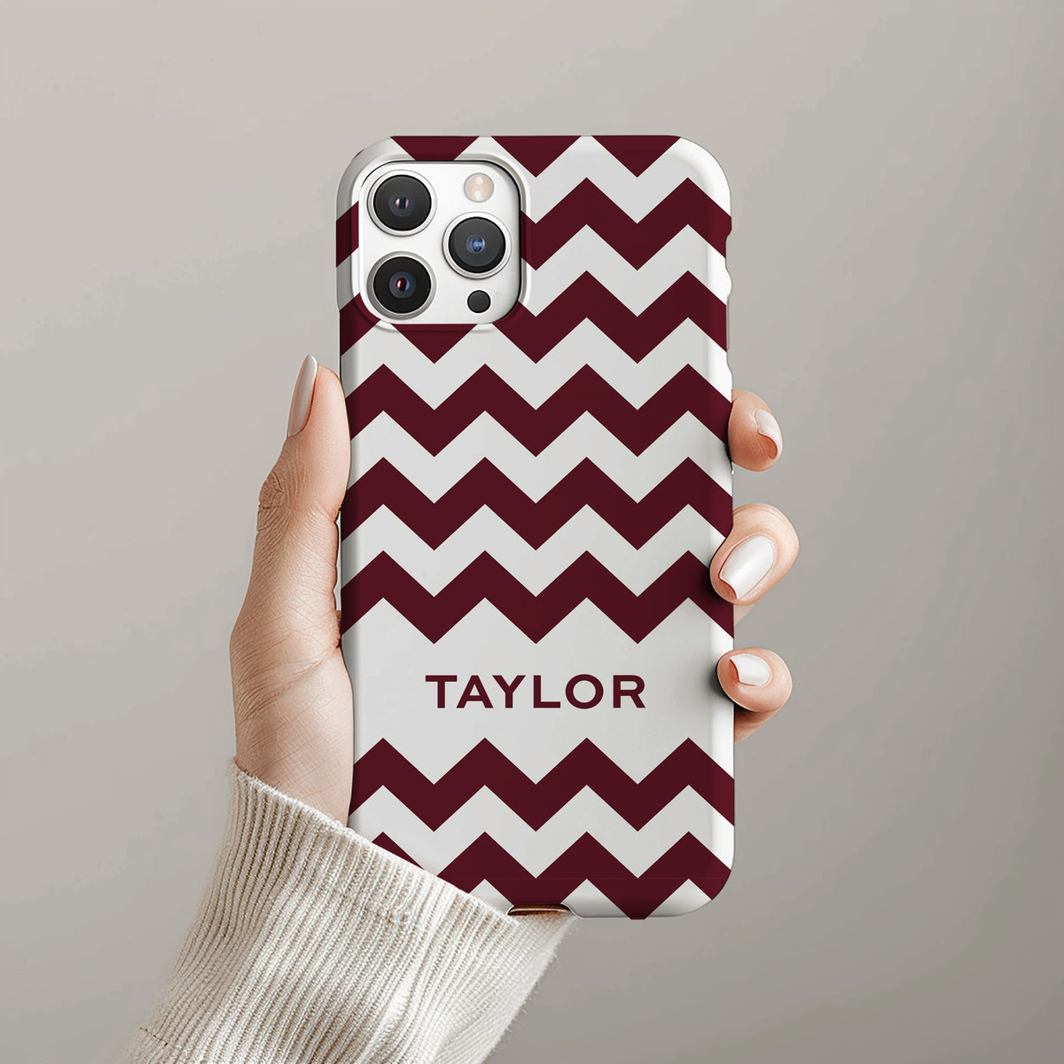 Personalizable maroon and white zigzag phone case for Bulldog fans – a playful, bold design that adds a stylish twist to your team pride with a monogrammed touch!