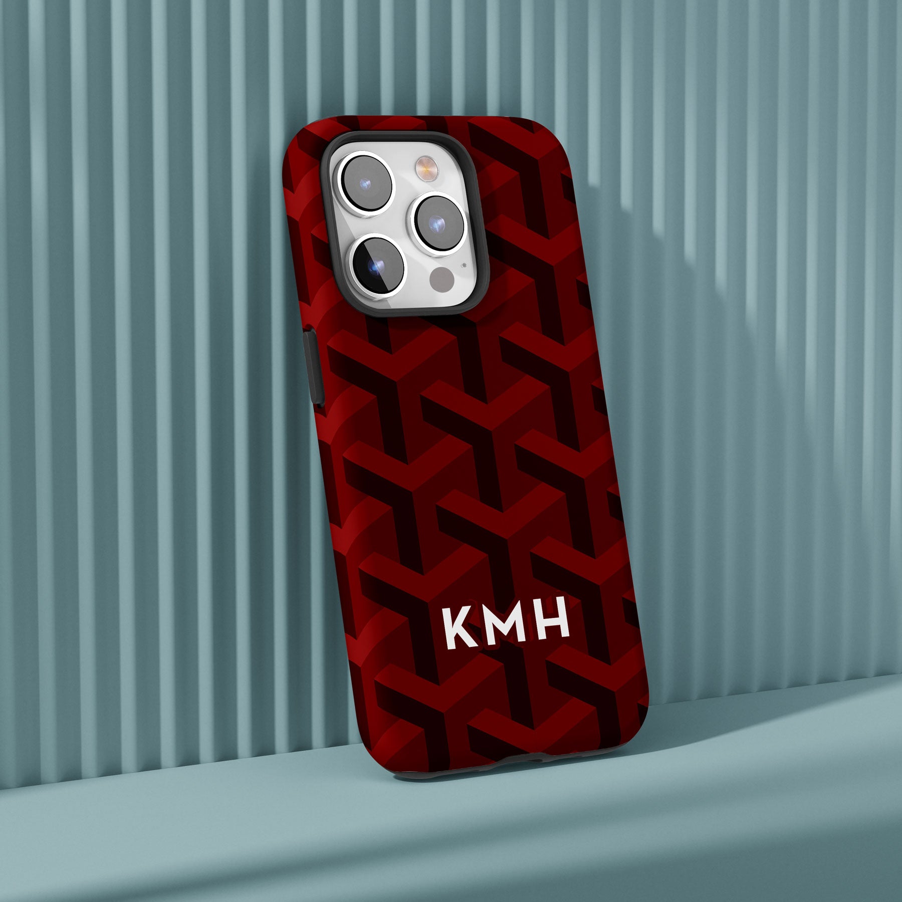 Personalizable maroon geometric phone case for Texas fans – featuring an intricate, luxury-inspired pattern for a sophisticated, stylish look.