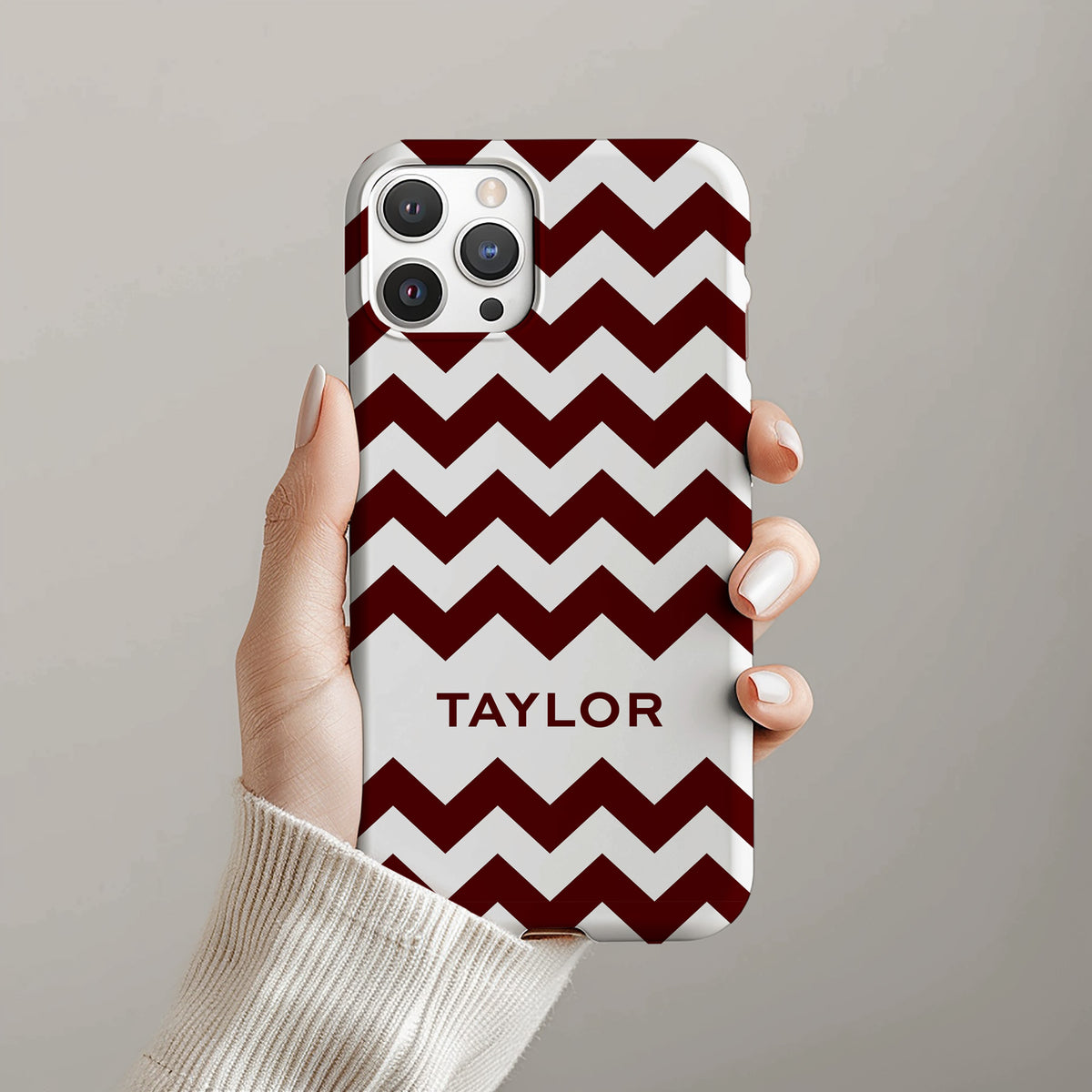 Personalizable maroon zigzag phone case for Texas fans – a bold, dynamic design with striking geometric lines for a fun and stylish look.