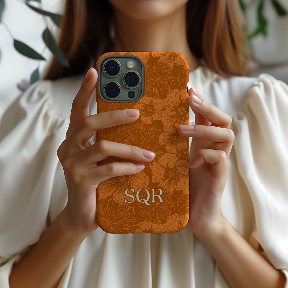 Personalizable burnt orange floral phone case for Texas fans – a playful, tone-on-tone floral design that brings vibrant energy and stylish flair to your phone.