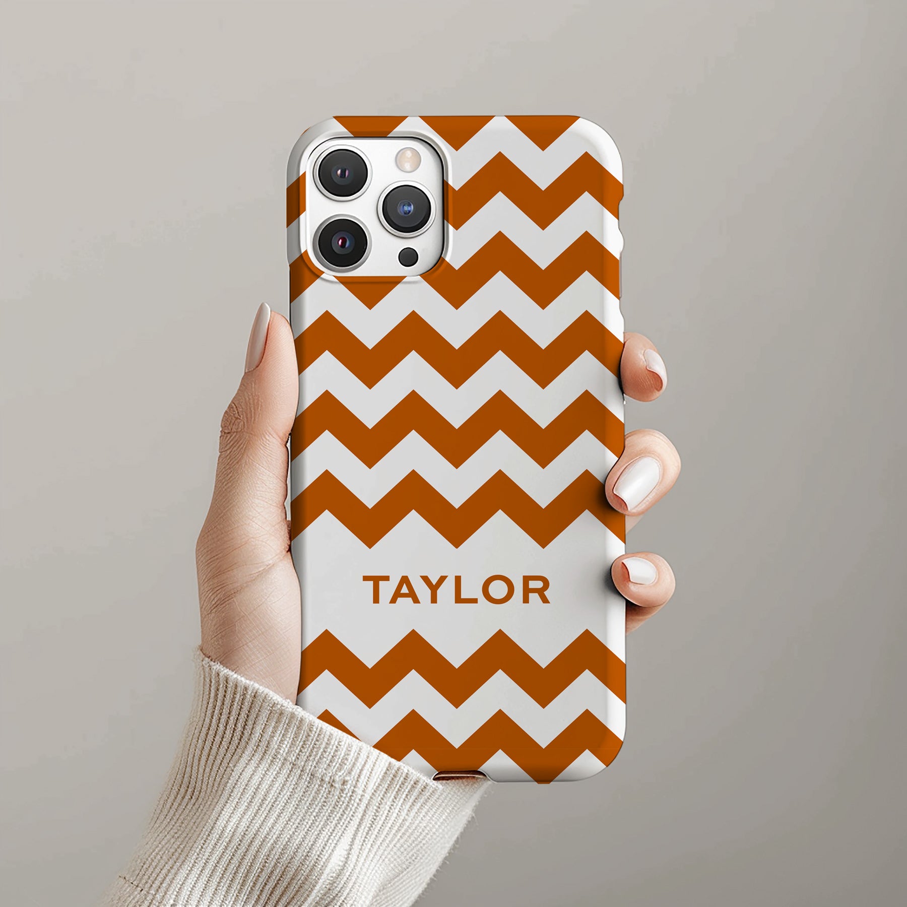 Personalizable burnt orange zigzag phone case for Texas fans – a bold, dynamic design with striking geometric lines for a fun, lively look.