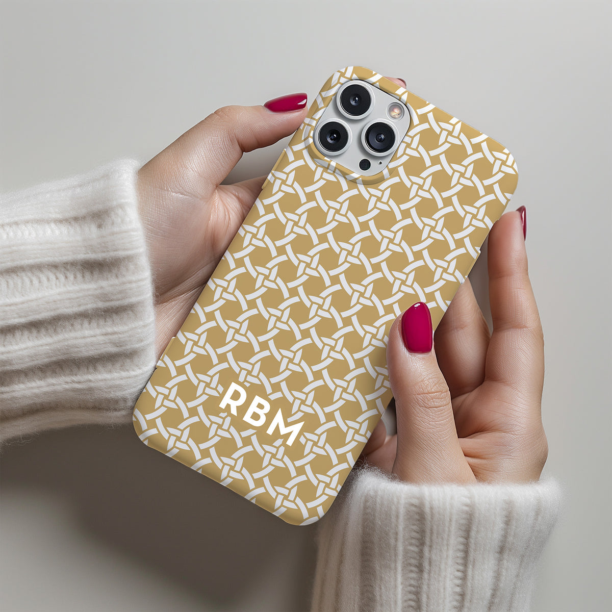 Personalizable basketweave phone case from Nashville Gold – intricate interlocking circles create a subtle, sophisticated texture for a timeless look.